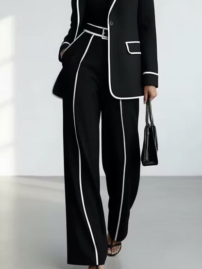 María Soledad | Traje Negro con Ribetes